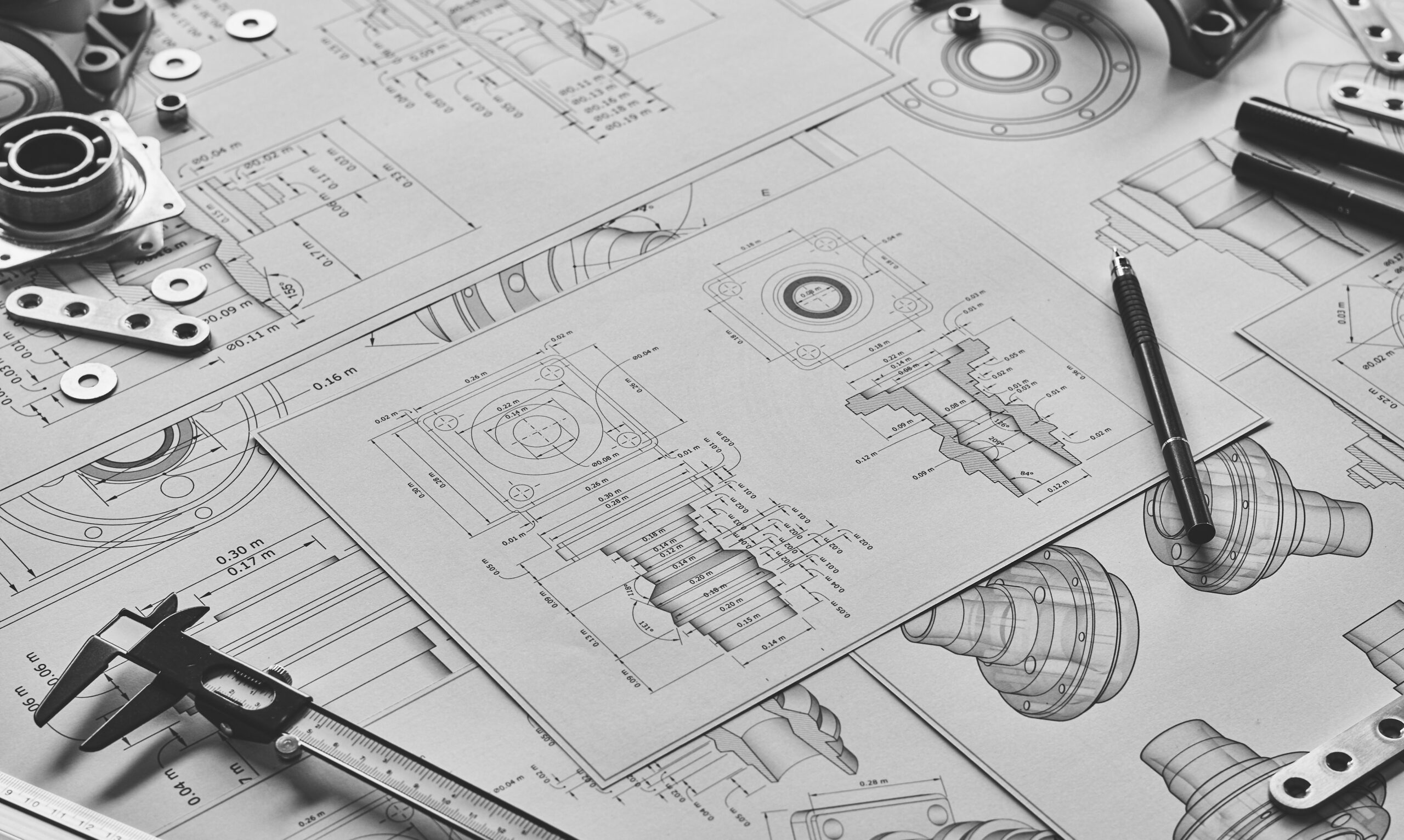 Engineer technician designing drawings mechanical parts engineering Engine manufacturing factory Industry Industrial work project blueprints measuring bearings caliper tools.